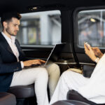 business-people-sitting-in-minivan-taxi-2025-03-13-15-32-26-utc