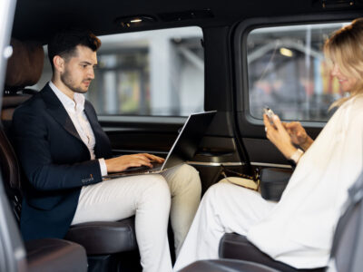 business-people-sitting-in-minivan-taxi-2025-03-13-15-32-26-utc