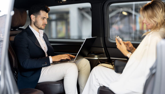 business-people-sitting-in-minivan-taxi-2025-03-13-15-32-26-utc