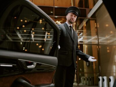 chauffeur-awaiting-arrival-at-building-entrance-2026-03-26-23-23-50-utc
